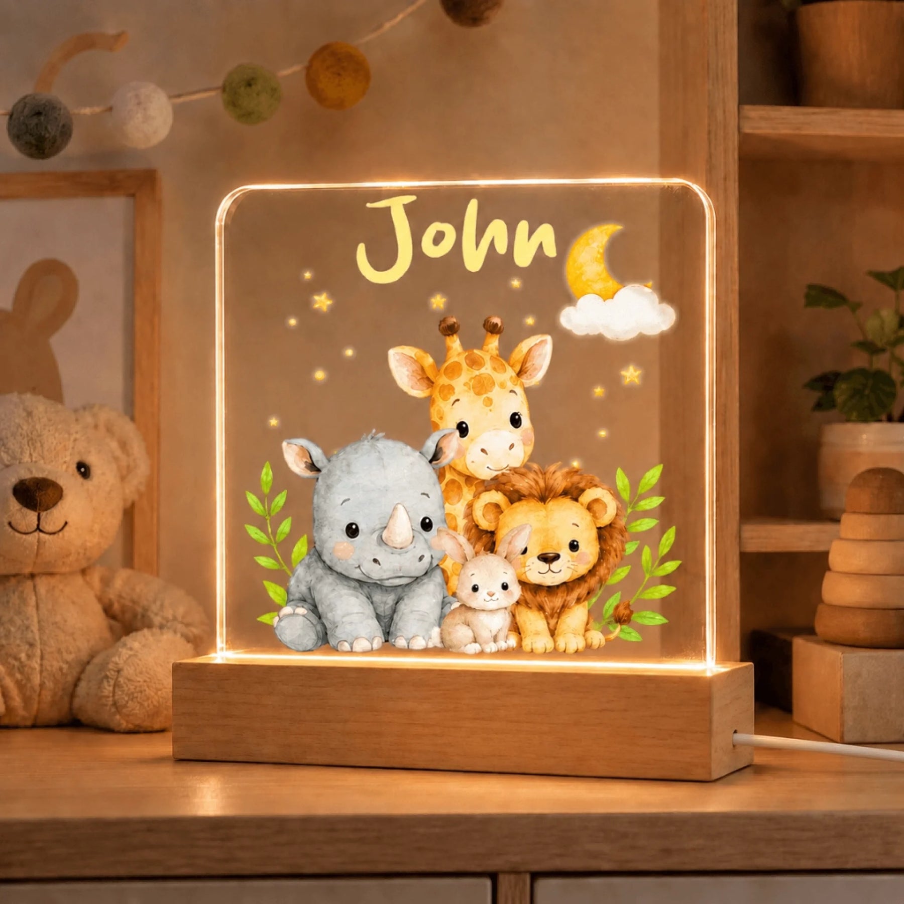 Custom name night light featuring adorable forest animals and moon decor ideal for baby nursery room lighting.