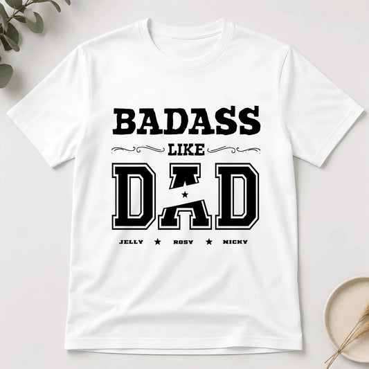 White t-shirt with 'BADASS LIKE DAD' text on a light gray background