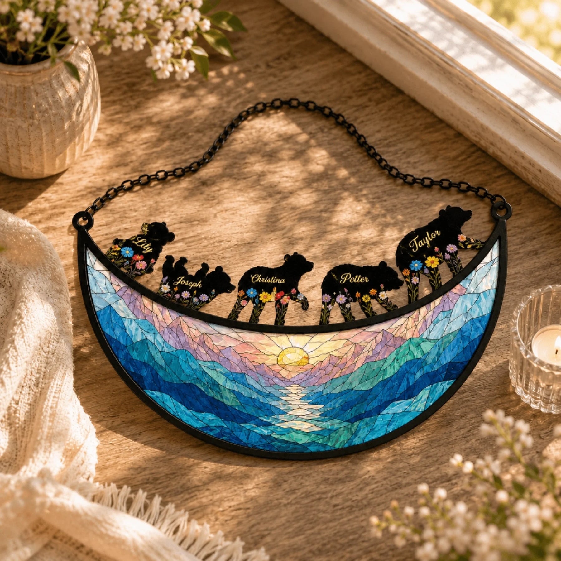 Customized bear family suncatcher on a wooden table, featuring engraved names and a colorful stained glass effect.
