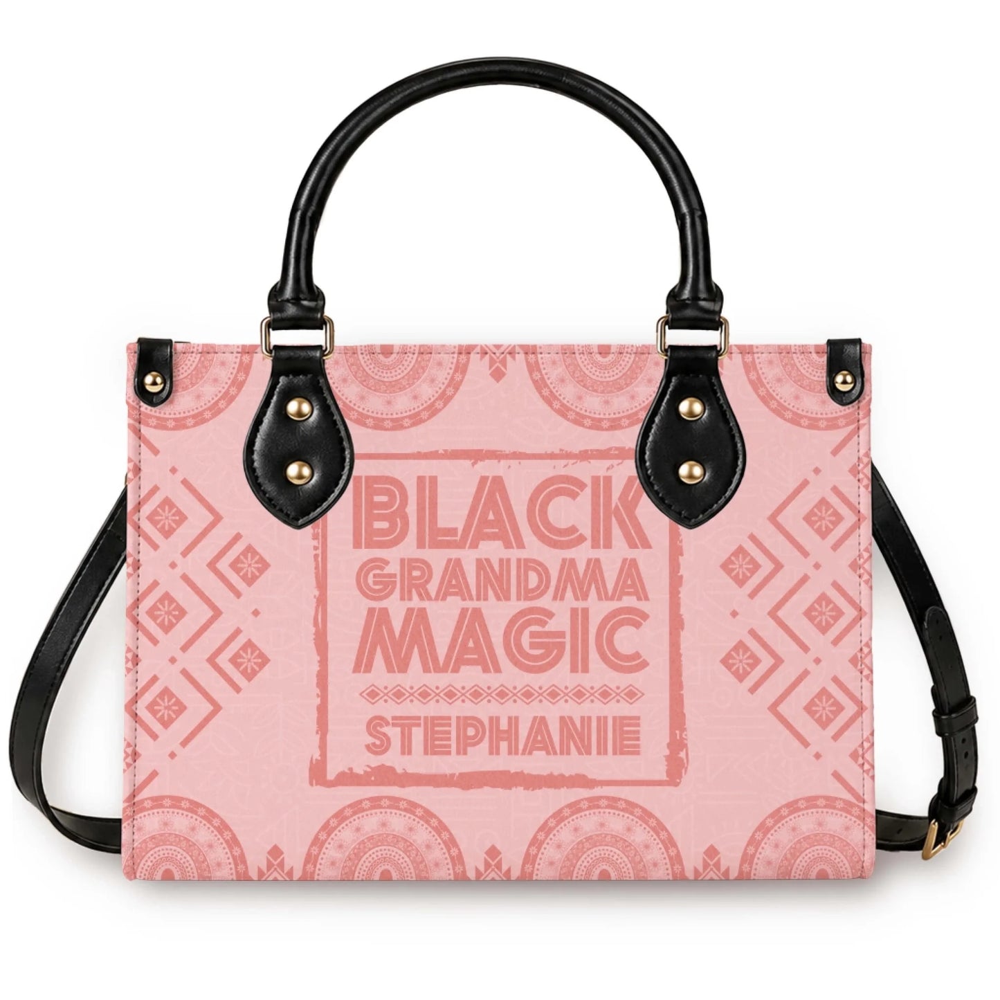 A personalized pink tote bag with black handles featuring the Black Grandma Magic design customized with the name Stephanie.