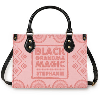 A personalized pink tote bag with black handles featuring the Black Grandma Magic design customized with the name Stephanie.
