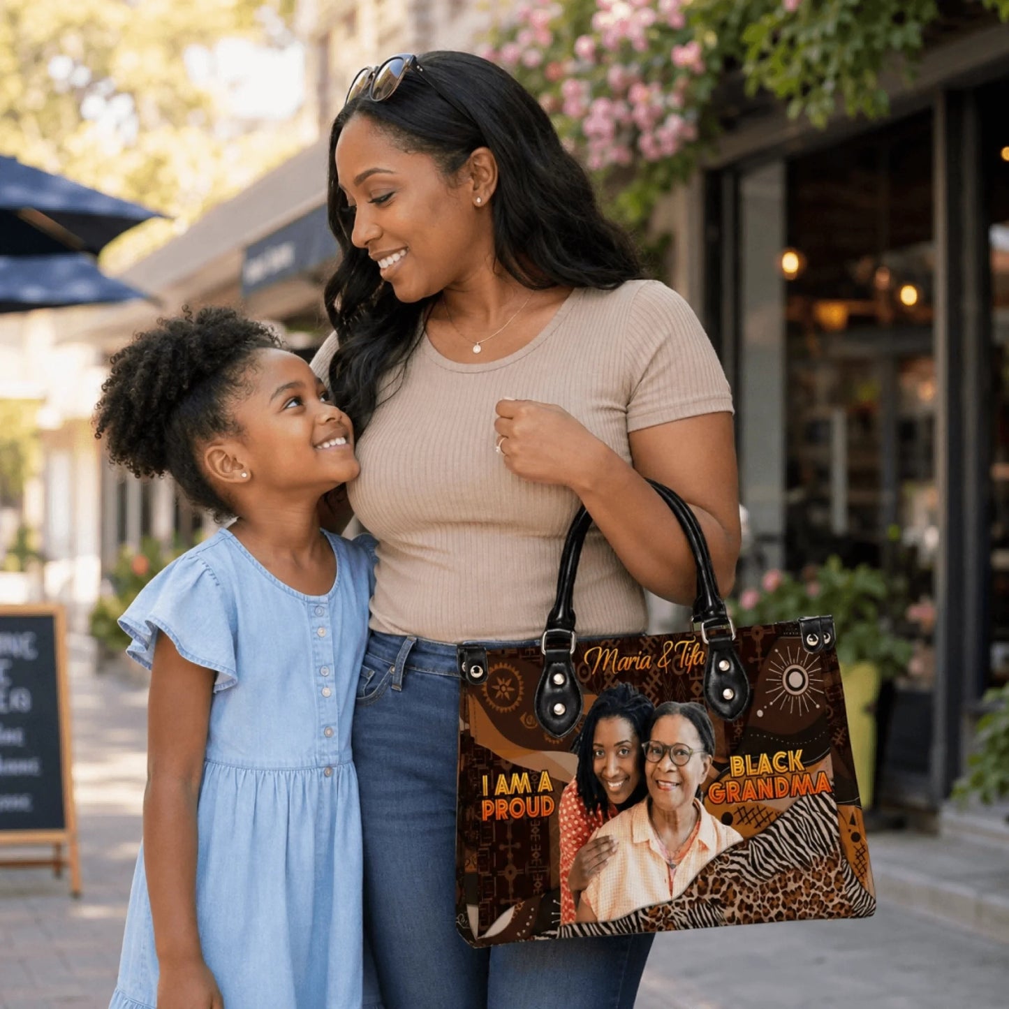 A mother and daughter holding a personalized tote bag featuring a custom photo and the text Black Grandma for Mother Day.