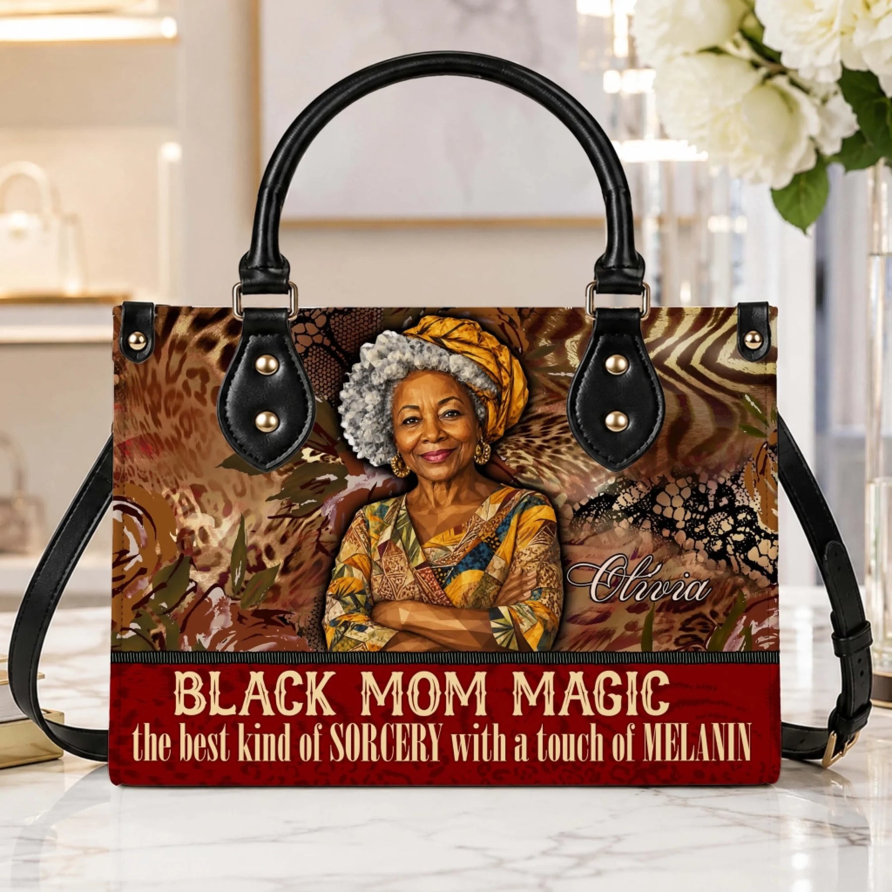 Decorative Black Mom Magic handbag with custom name accent sitting on a table as a unique gift for mom or birthday.