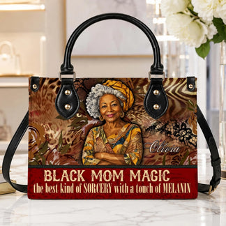 Decorative Black Mom Magic handbag with custom name accent sitting on a table as a unique gift for mom or birthday.