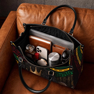 Spacious interior of a personalized Black queen tote bag filled with everyday essentials like a laptop and perfume.