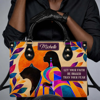 A personalized handbag featuring a black woman and panther design with the inspirational quote Let Your Faith Be Bigger Than Your Fear.