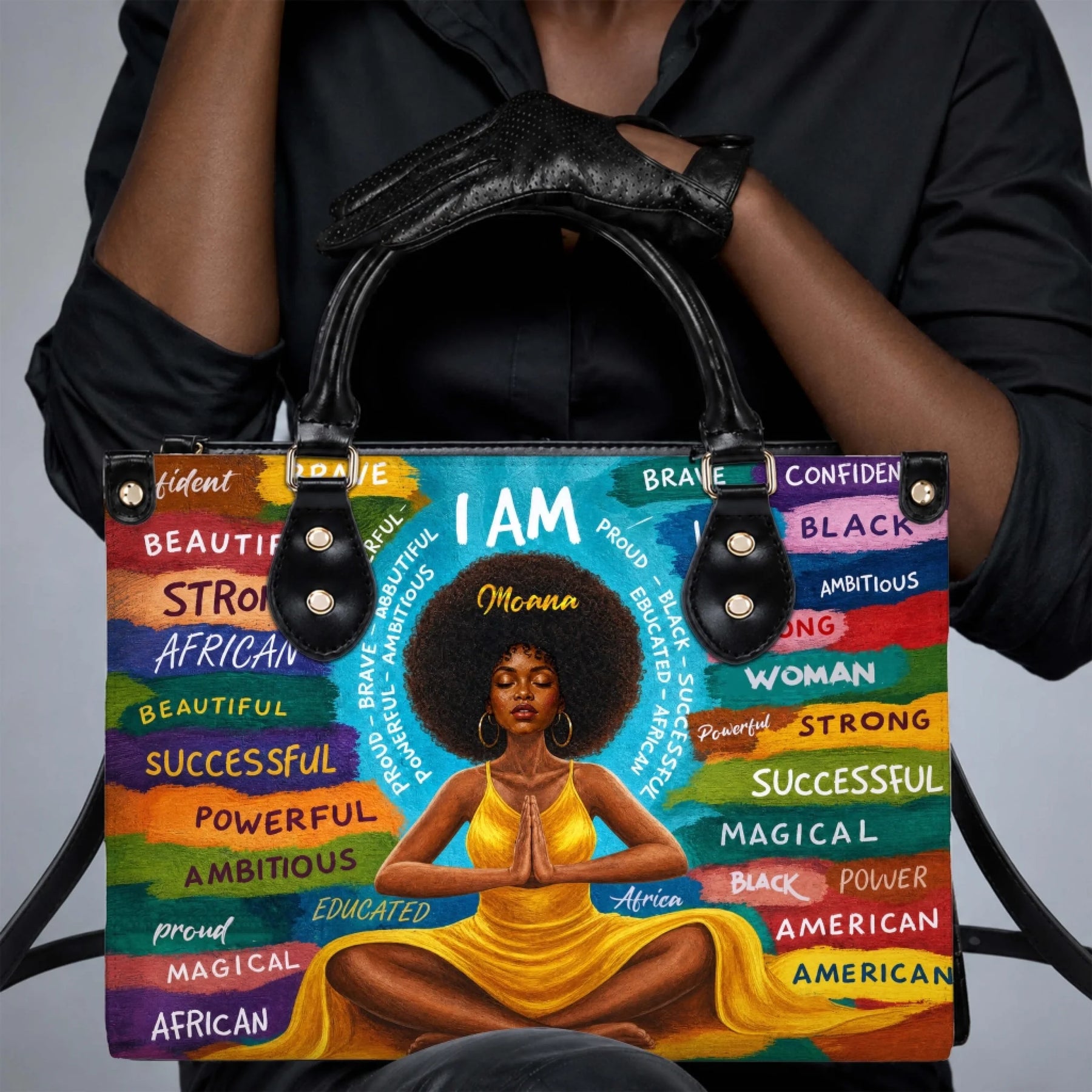 A stylish personalized PU leather handbag featuring a Black woman in a yellow dress meditating with empowering words.