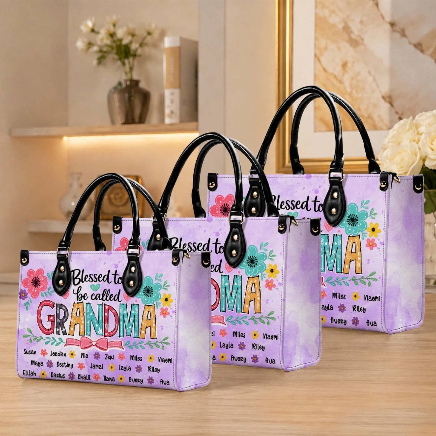A set of personalized purple watercolor PU leather handbags featuring a floral Blessed to be called Grandma design.