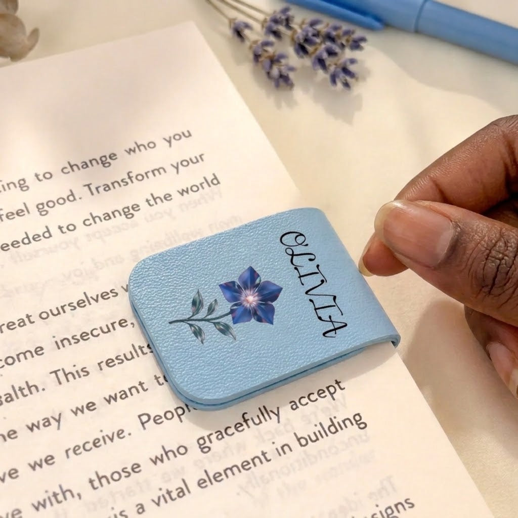 Personalized blue magnetic leather bookmark featuring a blue flower illustration and the custom name Olivia for readers.