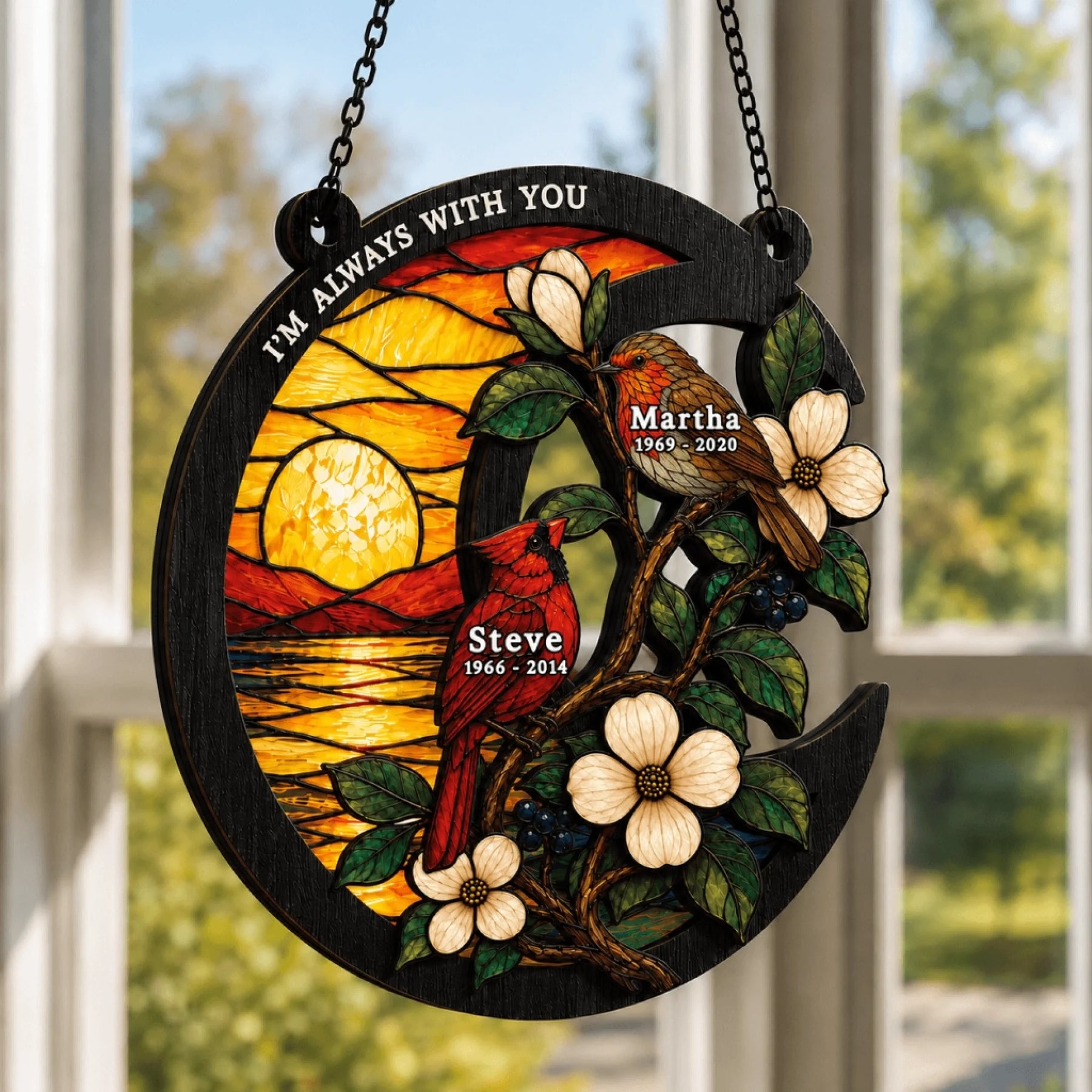 Memorial suncatcher in a crescent moon shape featuring cardinals, robins, and custom names for a sympathy gift.