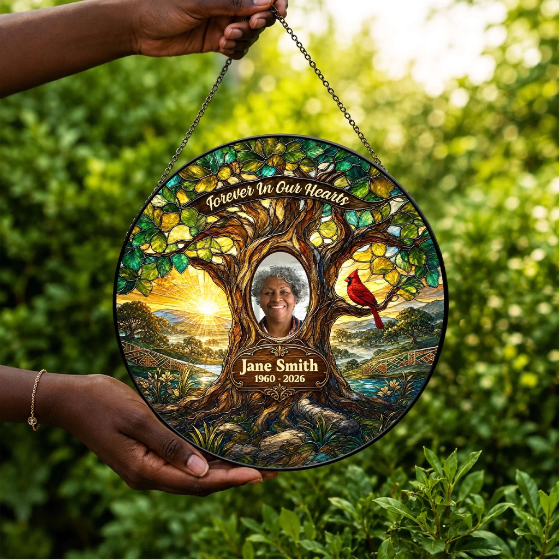 Custom memorial suncatcher featuring a cardinal on a tree with a photo of a loved one for sympathy decor