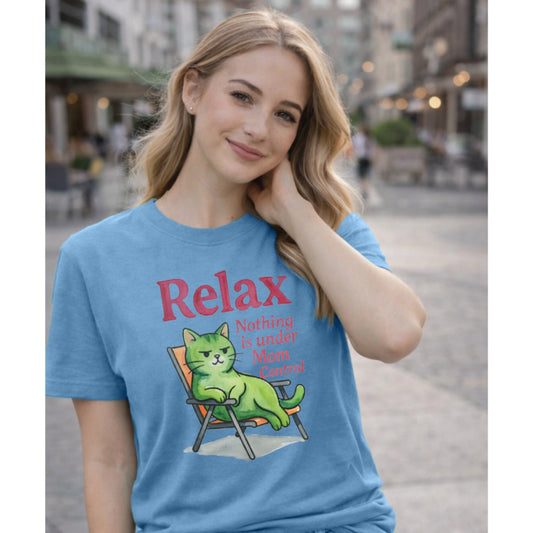 Woman wearing a blue t-shirt with a cat graphic and text in an urban setting