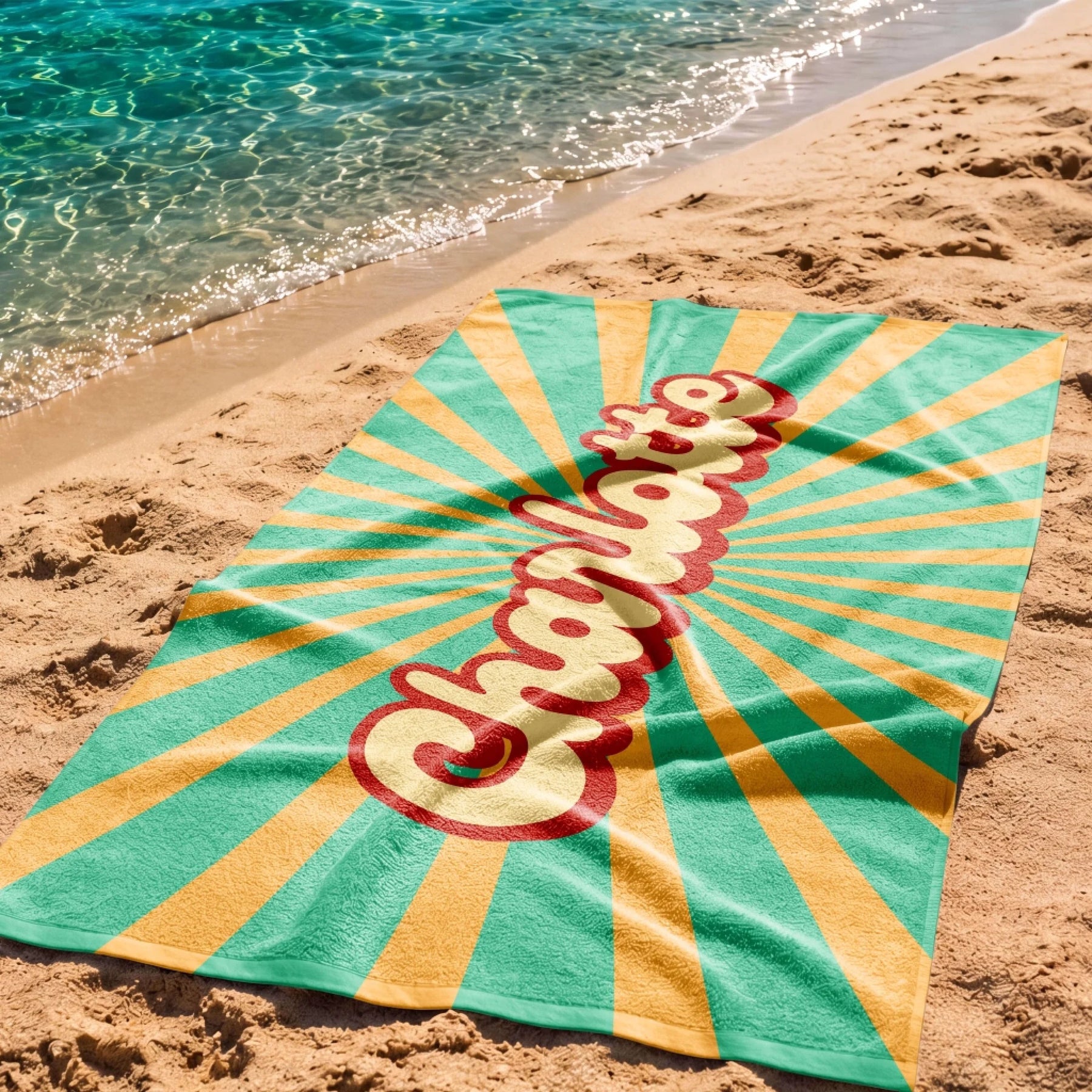 Custom beach towel featuring the name Charlotte in retro typography with a vintage yellow and teal sunburst pattern.