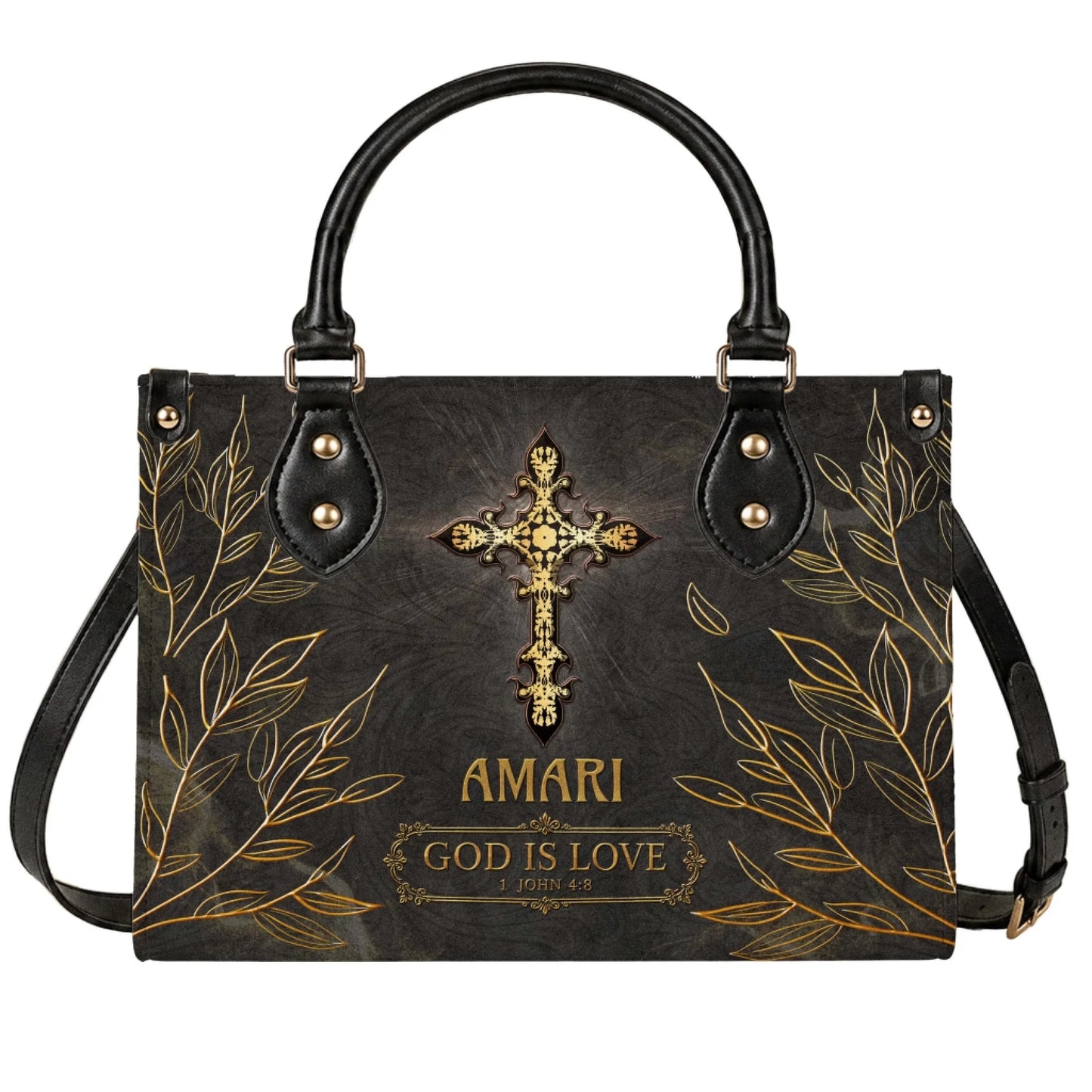 A stylish black leather tote bag featuring a gold decorative cross with the name Amari and the quote God is Love 1 John 4:8.