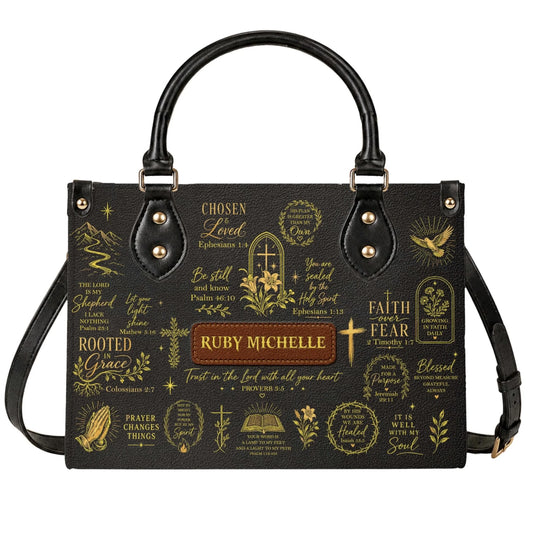 Black leather handbag featuring custom name Ruby Michelle, gold bible verses, and religious motifs for faith gifts.