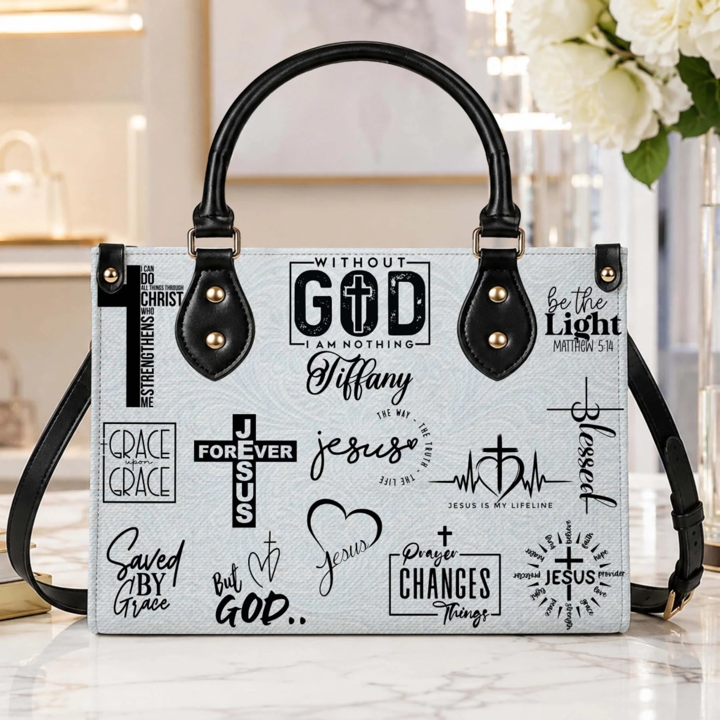 A stylish personalized handbag with Christian symbols and inspirational quotes perfect for a faith inspired gift.