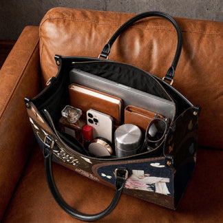 Christian tote bag featuring a cross and floral print filled with personal items, perfect for faith-inspired gifting.