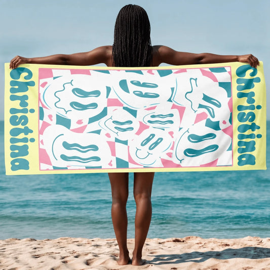 Personalized beach towel featuring a retro wavy smiley face pattern and the custom name Christina for summer beach days.