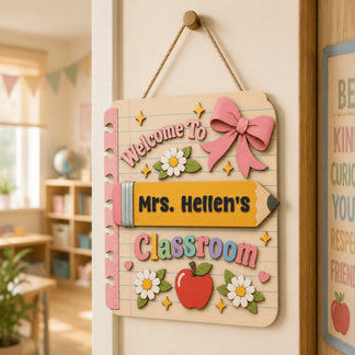Wooden classroom welcome sign personalized for a teacher, featuring a pencil motif and floral accents for door decor.