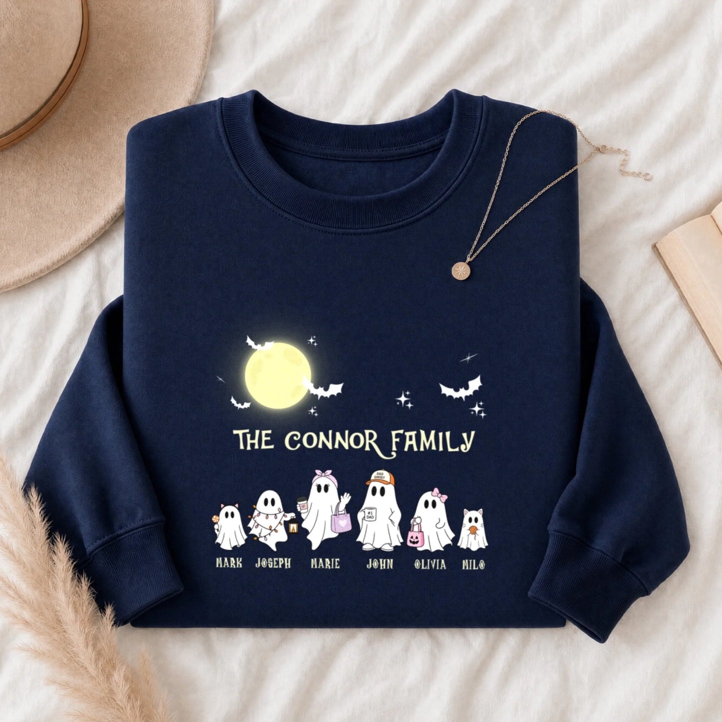 A navy blue personalized Halloween sweatshirt featuring a custom ghost family design with individual name labels.