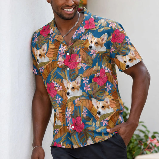 A man wearing a custom Hawaiian shirt featuring a personalized corgi face pattern with tropical flowers and palm leaves.