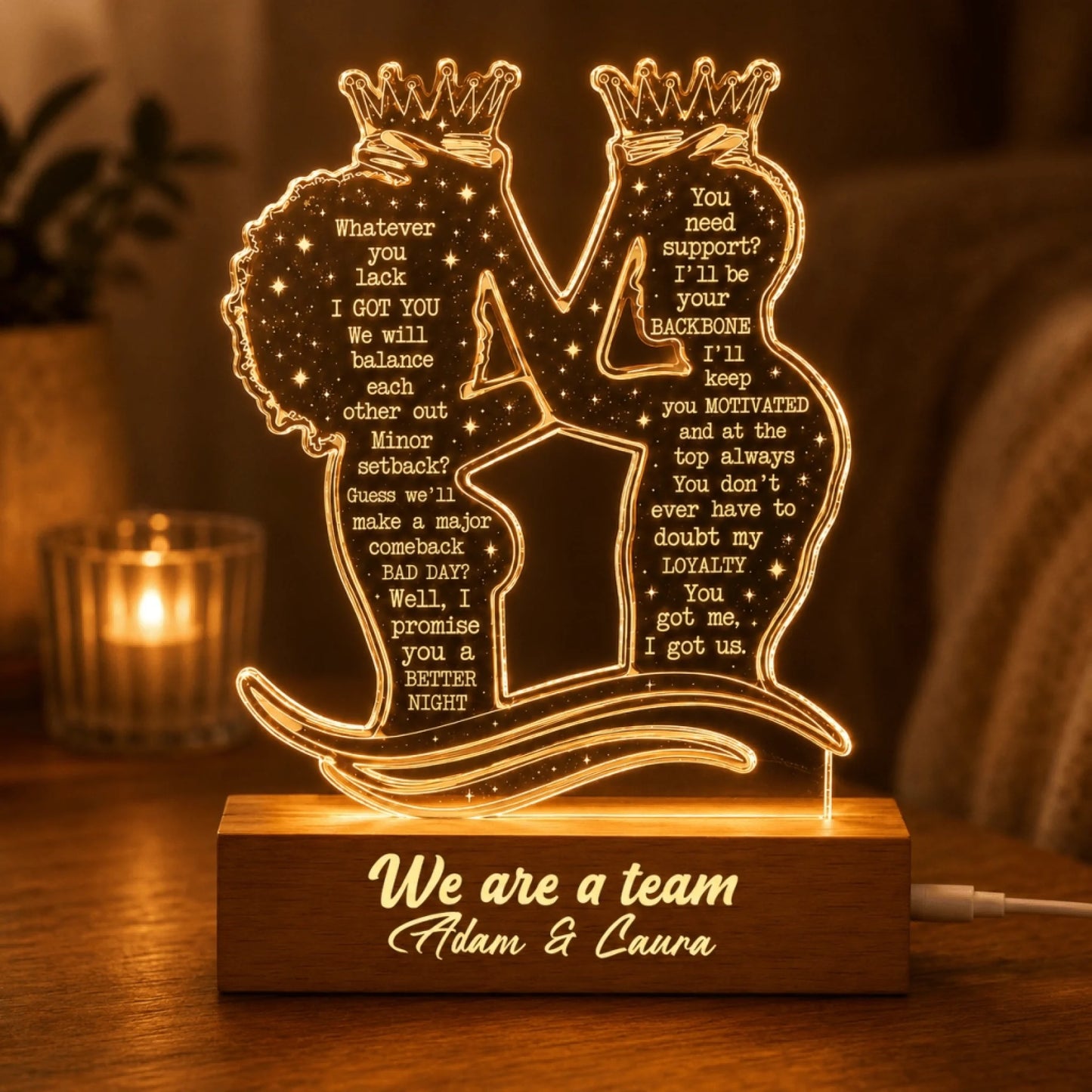 Custom LED night light with romantic message for couples, featuring personalized names Adam and Caura on wood base.