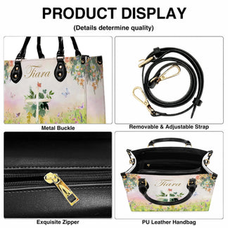 Product display showing the metal buckle, adjustable strap, zipper, and interior of a personalized floral cross PU leather handbag.
