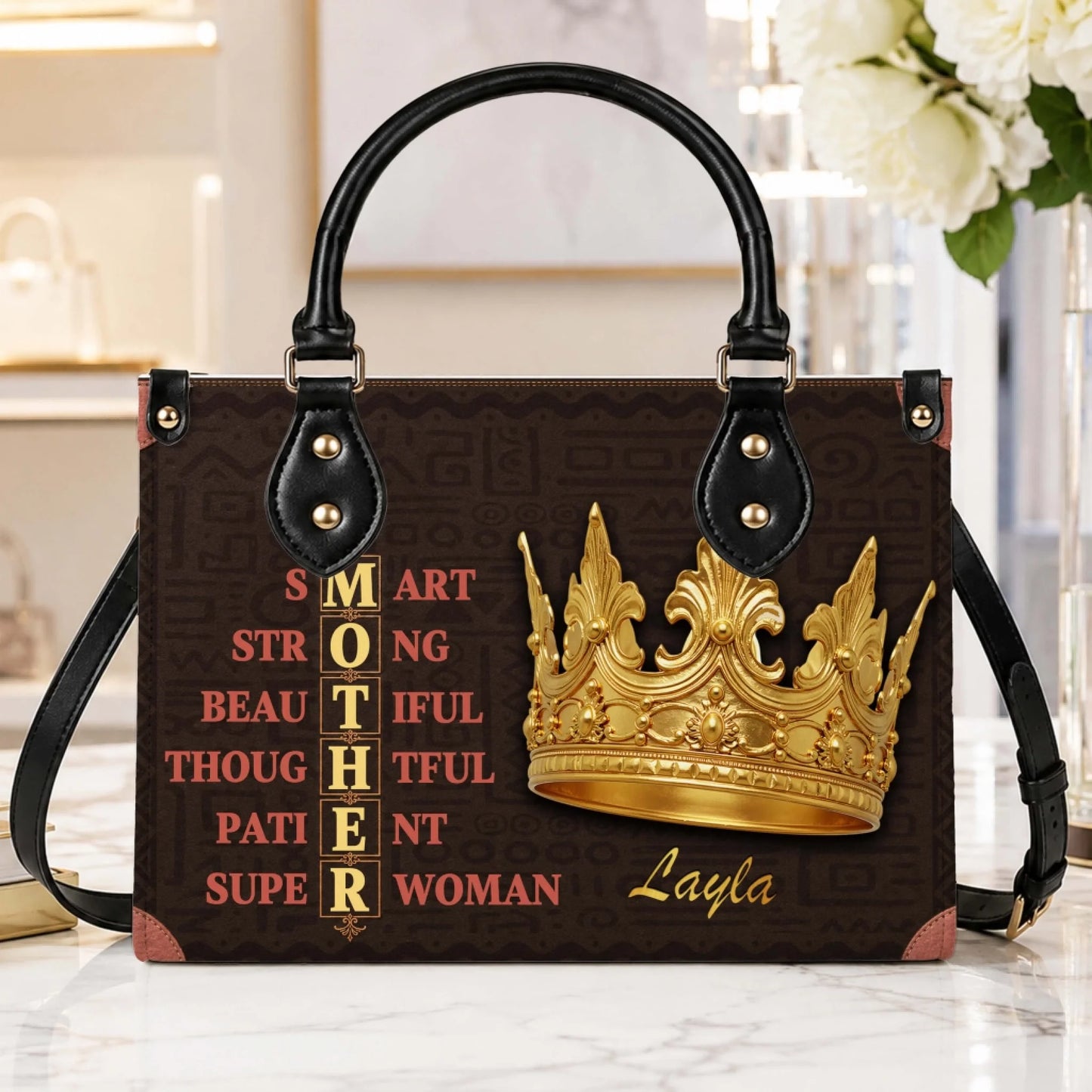 A beautiful personalized handbag for mom with a golden crown illustration and the name Layla, displayed in a home.