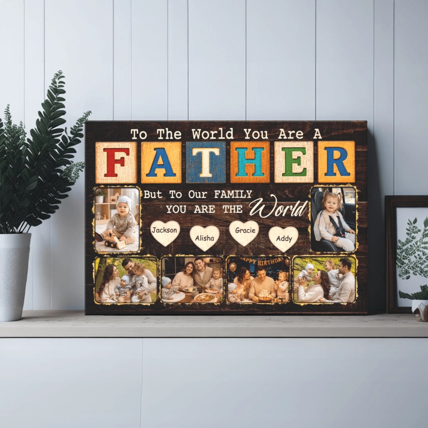 Decorative wall art with text 'To The World You Are A Father But To Our Family YOU ARE THE World' and family photos.