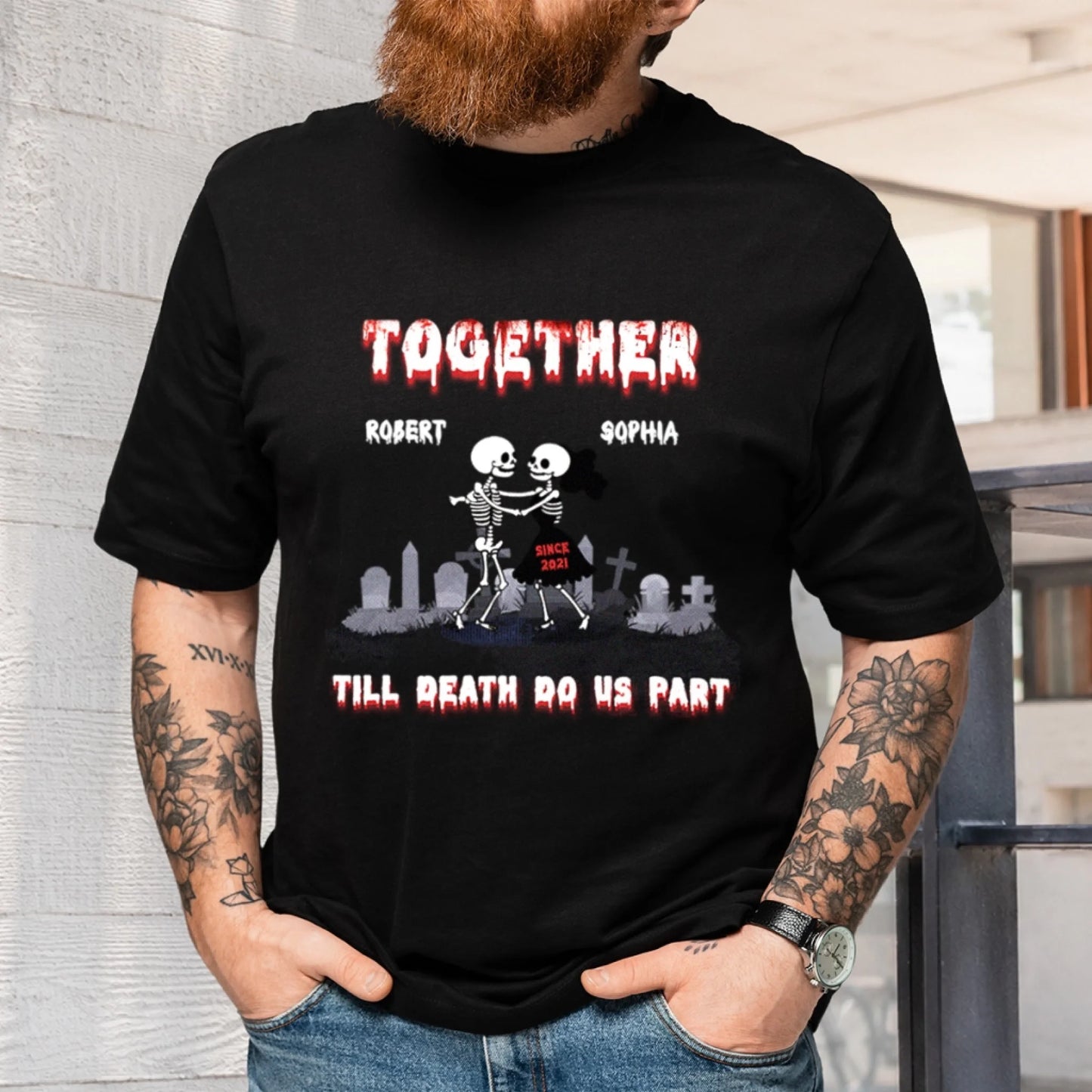 A black personalized t shirt showcasing dancing skeletons with custom names Robert and Sophia, ideal for anniversaries or gothic couple gifts.