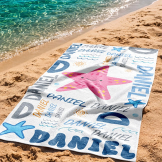 Custom name beach towel featuring a pink starfish and blue Daniel text, perfect for summer vacations and pool parties.