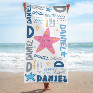 Custom beach towel for kids featuring a cute pink starfish illustration and the name Daniel in colorful typography.