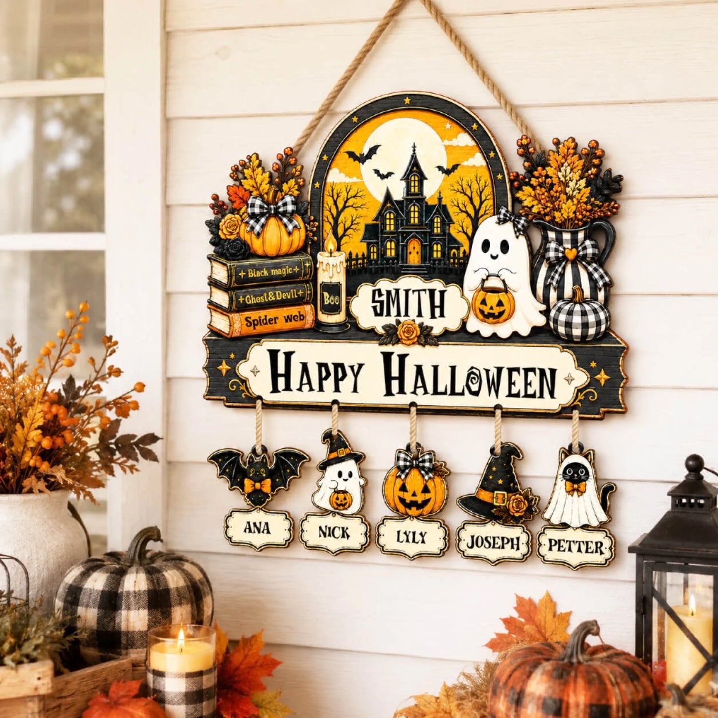 Personalized family Halloween wooden door sign featuring a haunted house design with custom family name and hanging ghosts.