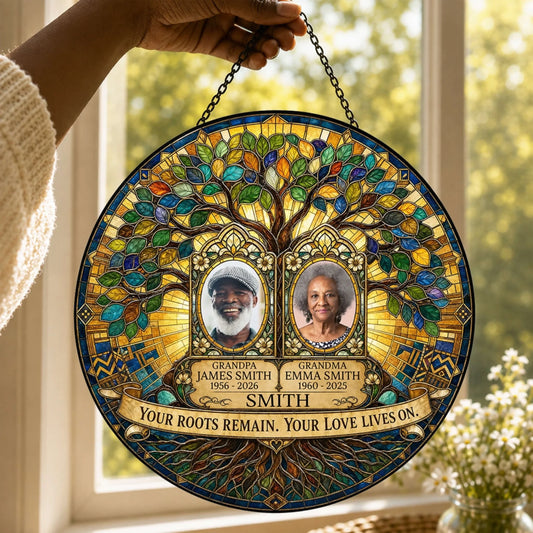 Custom family memorial suncatcher featuring a stained glass tree design with photos, names, and remembrance dates.