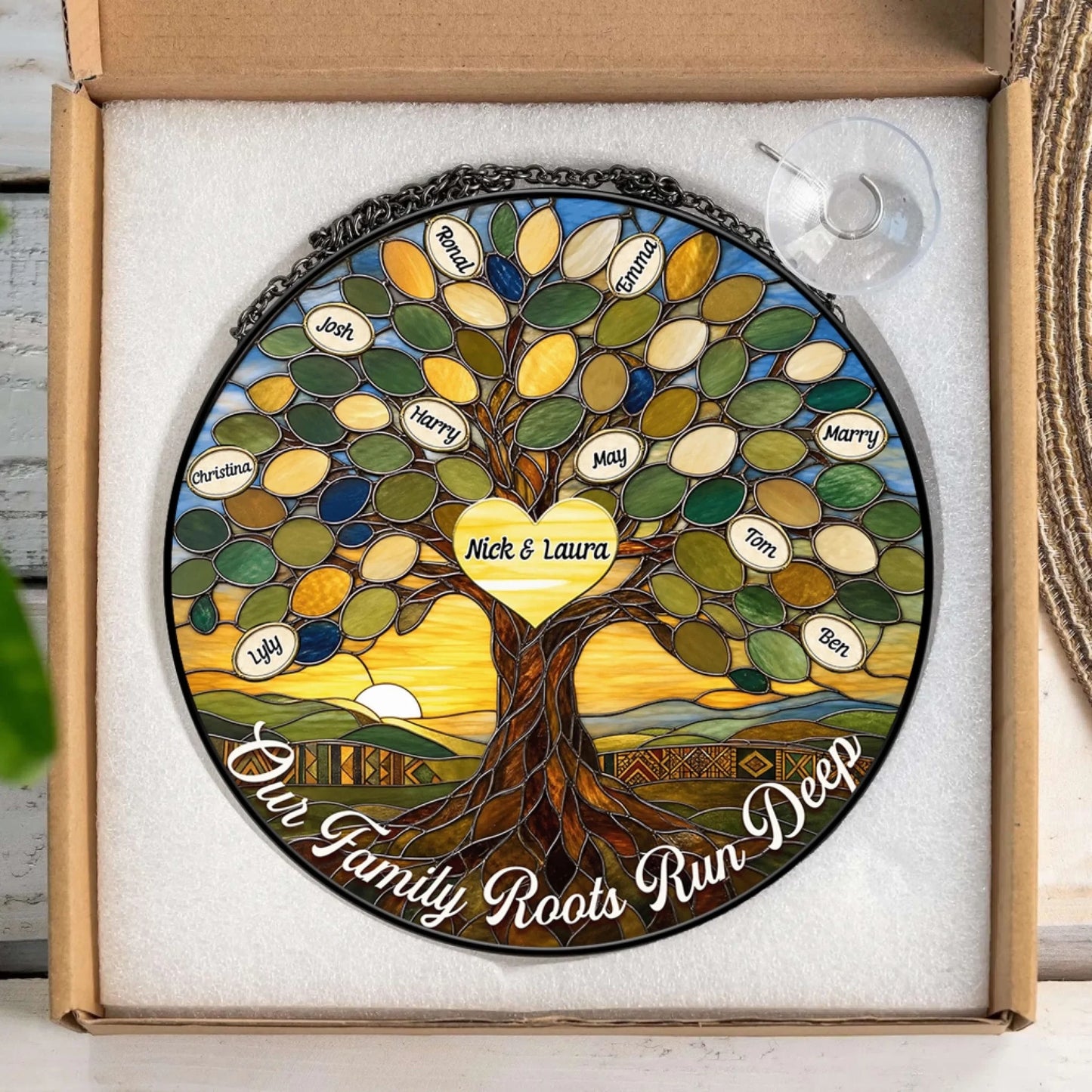 Round stained glass suncatcher featuring a family tree design with custom names and the quote Our Family Roots Run Deep.