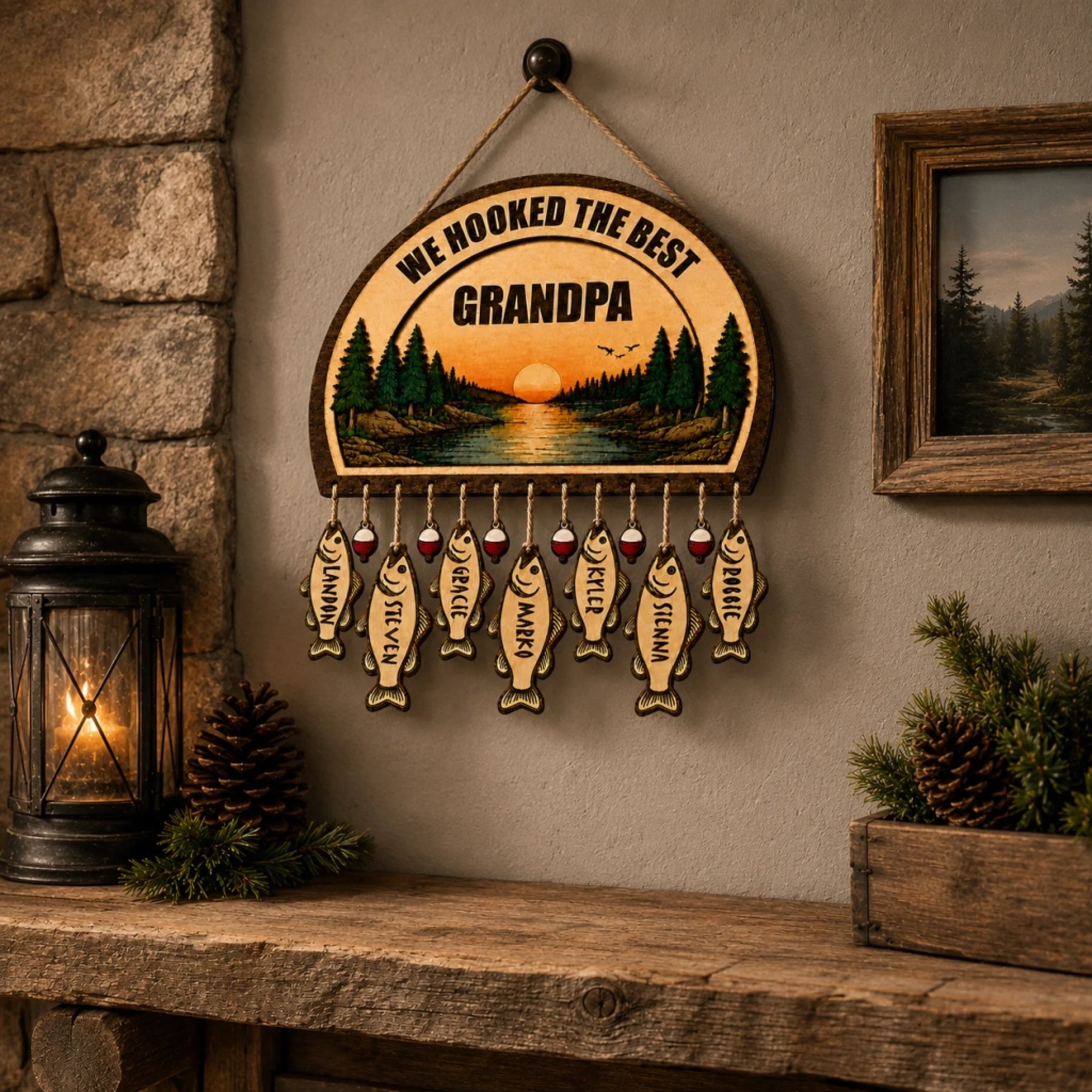 Rustic wooden sign designed for grandpa, displaying a serene sunset lake and hanging fish tags with family member names.