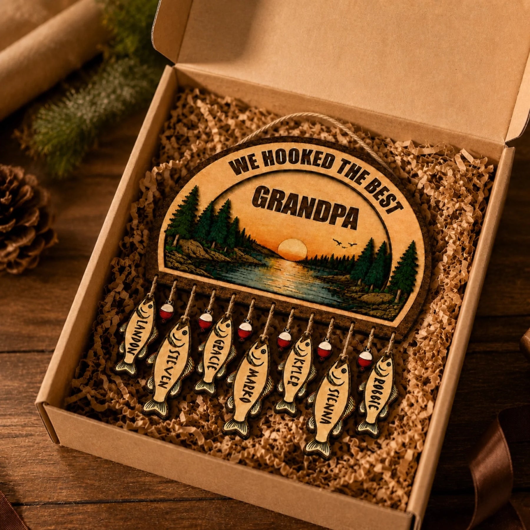 Custom personalized wooden fishing gift for grandpa, neatly packaged in a box with hanging fish name tags for family.