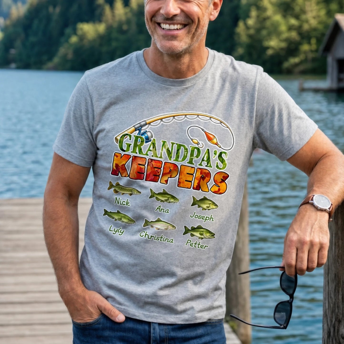 Grey personalized fishing t-shirt for grandpa featuring custom grandchildren names and fish graphics, a great gift for fishing lovers.