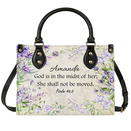 A personalized handbag featuring purple floral accents and the Bible verse Psalm 46 5 with the name Amanda customized.