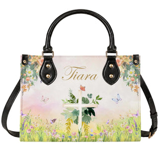 A custom floral cross handbag featuring the name Tiara, decorated with watercolor flowers and butterflies for a religious gift.