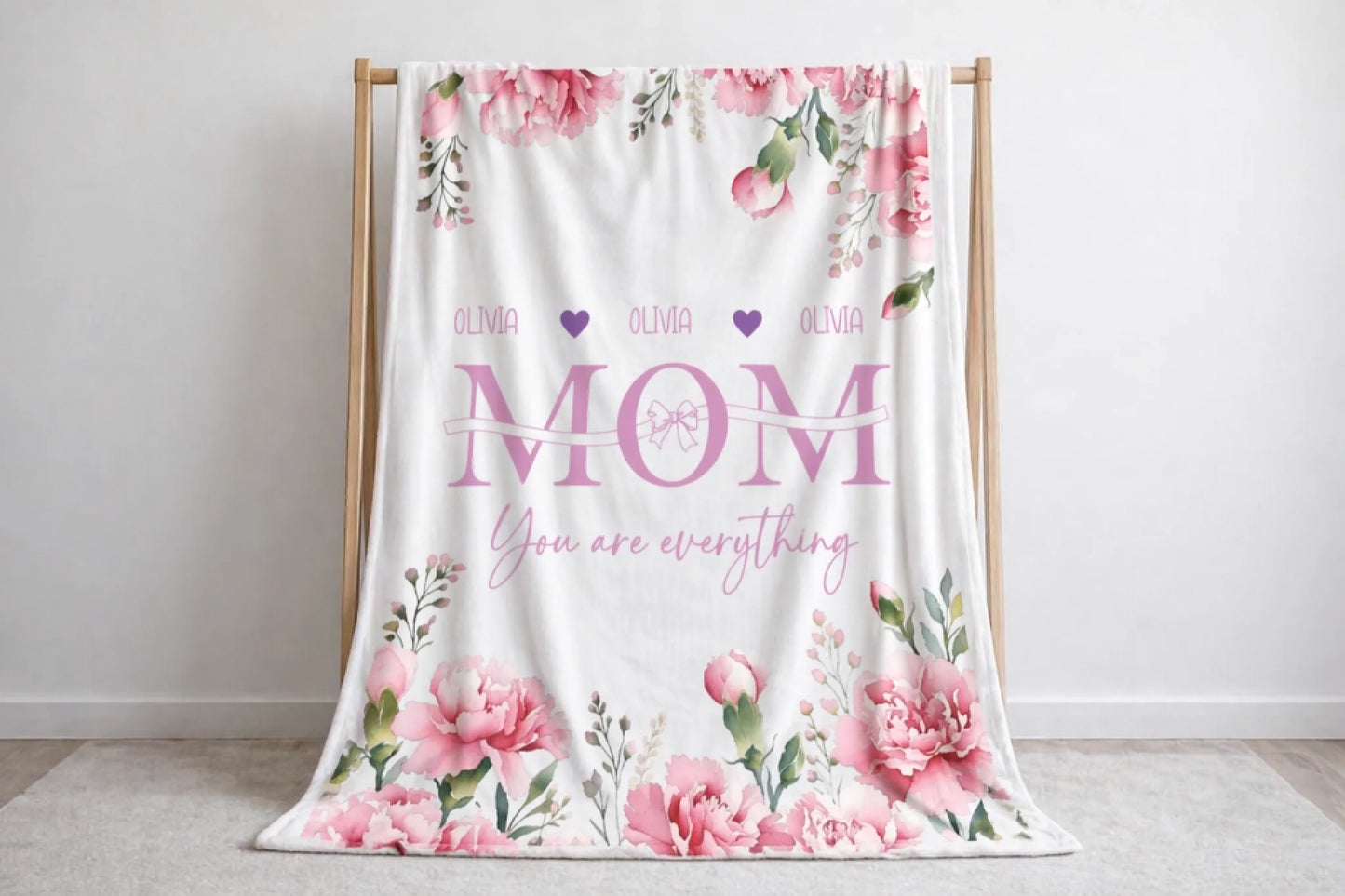 Decorative floral fleece blanket personalized with the name Olivia and Mom You are everything script for a unique gift.