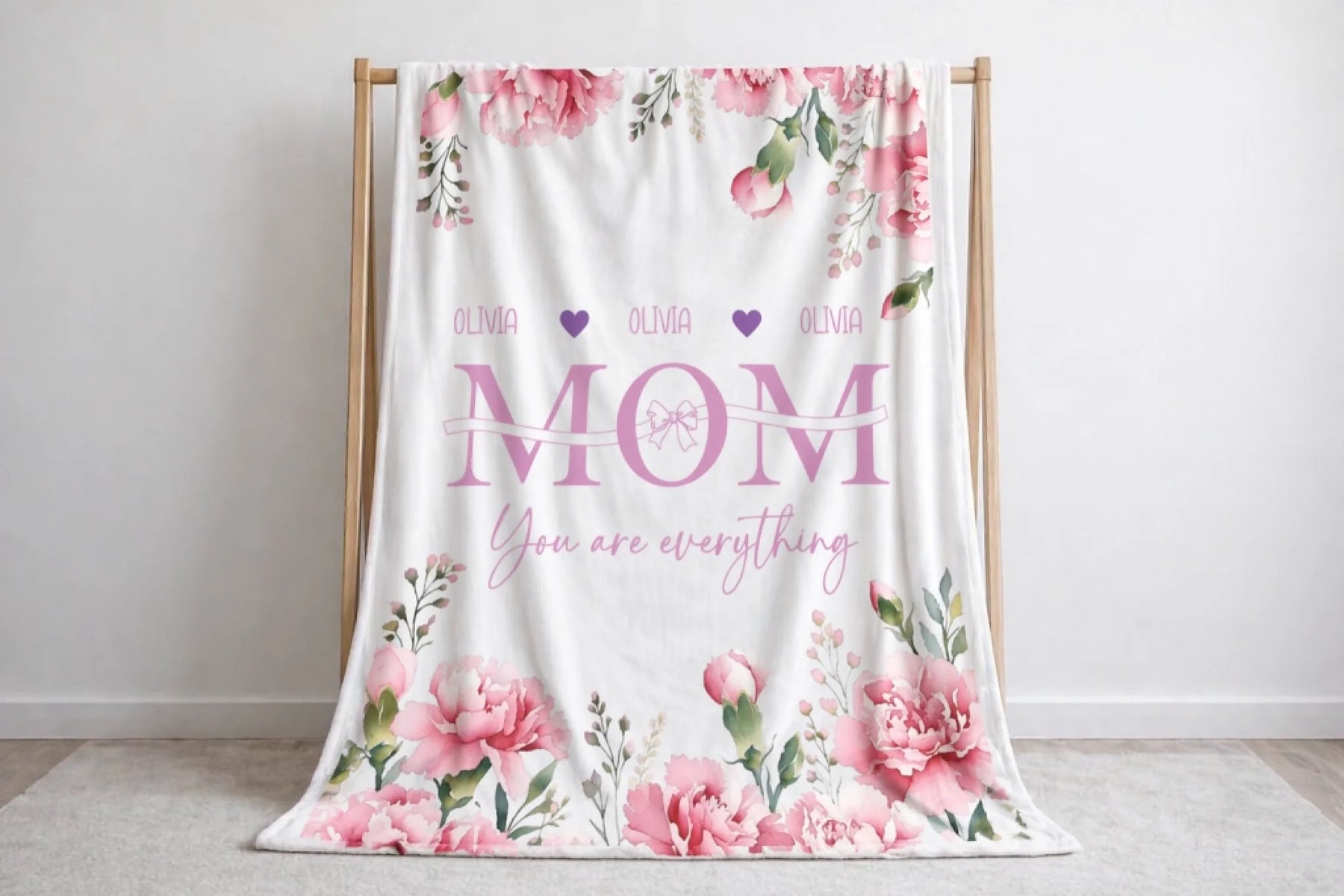 Decorative floral fleece blanket personalized with the name Olivia and Mom You are everything script for a unique gift.