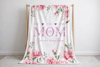 Decorative floral fleece blanket personalized with the name Olivia and Mom You are everything script for a unique gift.