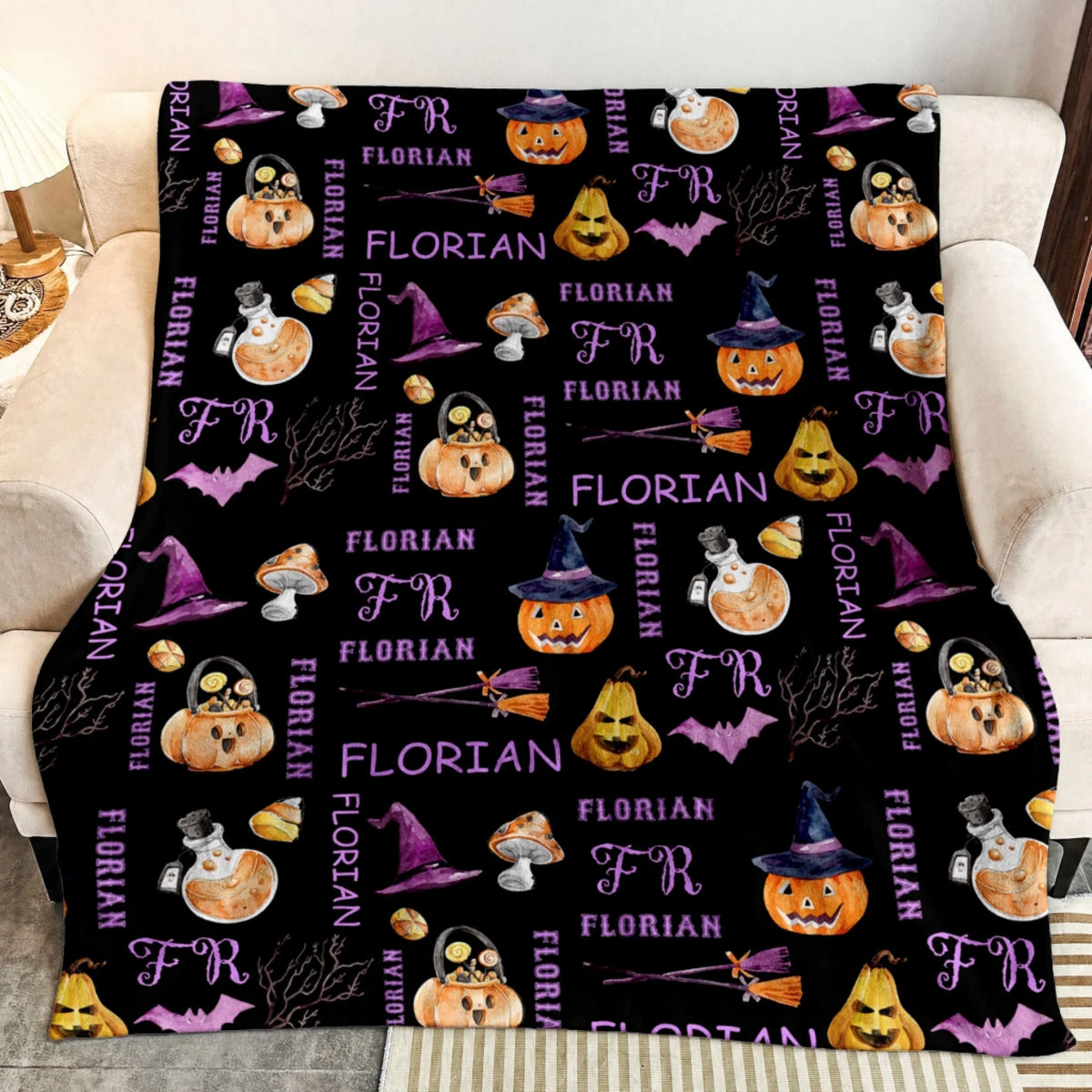 Personalized black throw blanket for Halloween featuring a custom Florian name pattern with pumpkins, potions, and bats.