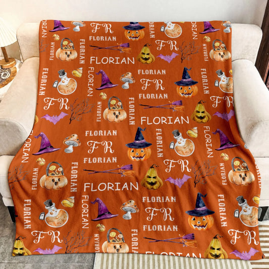 Personalized orange throw blanket for Halloween featuring a custom Florian name pattern with pumpkins, potions, and bats.