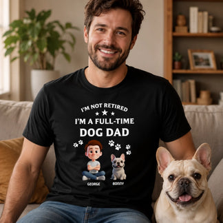 Man wearing a black t-shirt with a dog-themed design, sitting next to a dog in a living room.