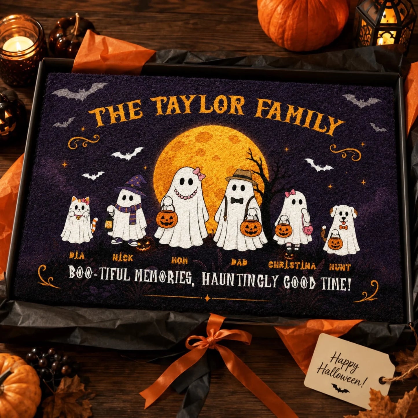 Customized halloween ghost family doormat with pet names presented in a gift box for a holiday themed family surprise.