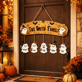Personalized wooden Halloween wall decor for front doors featuring cute ghost family characters with custom name ornaments.