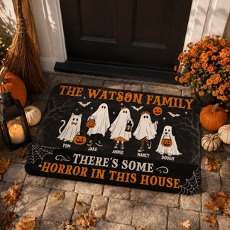 Festive halloween doormat with custom ghost family characters and names, perfect for welcoming guests during October.