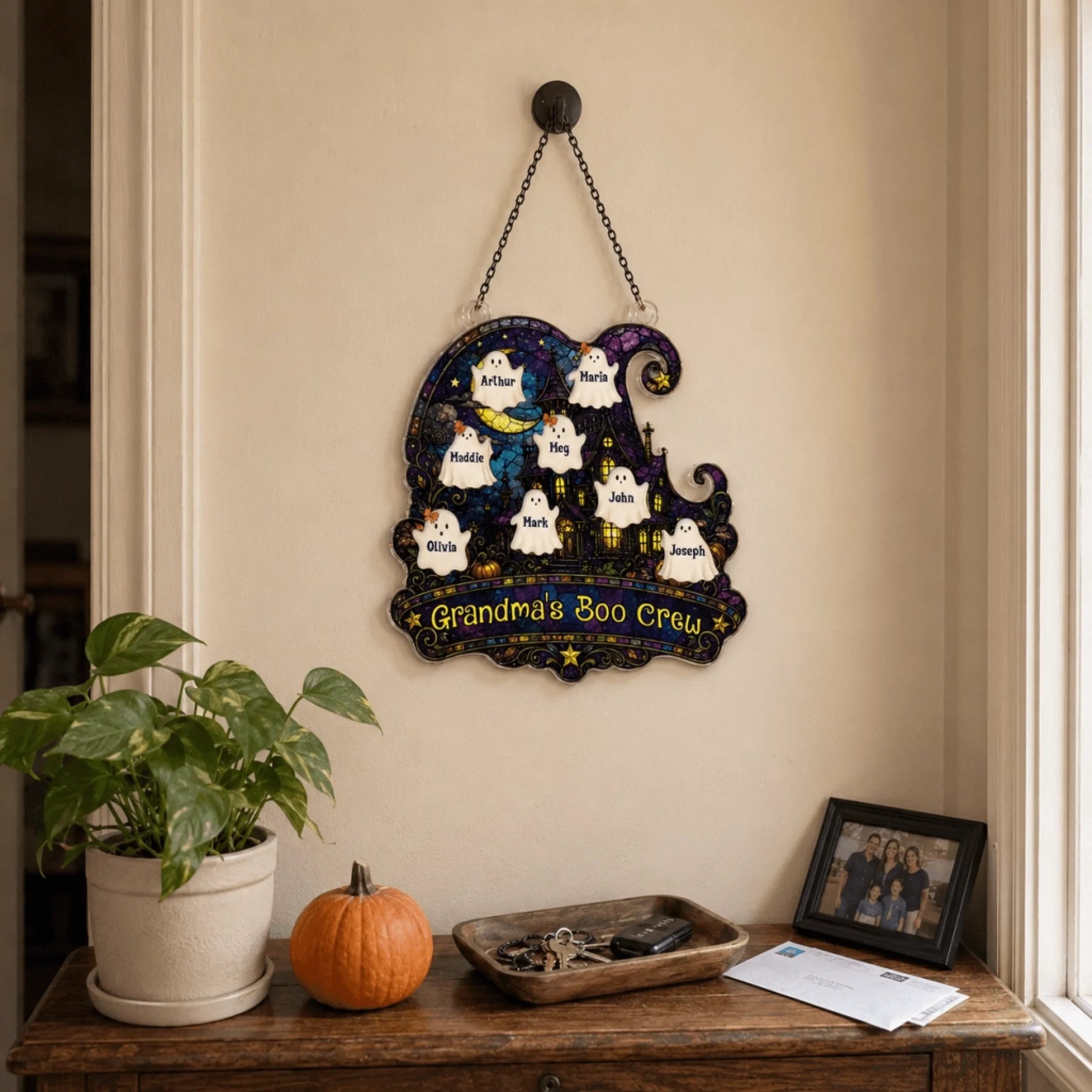 Personalized Grandma's Boo Crew wall plaque with ghost names, styled on an entryway table for Halloween home decor.